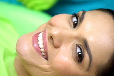 A woman smiling in the dentist’s chair