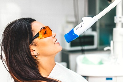 A woman having her teeth whitened