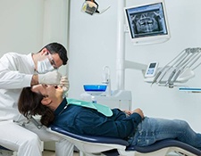 dentist working on a patient’s mouth 