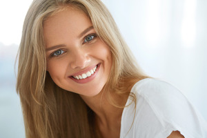 Close-up of blonde woman with a beautiful smile