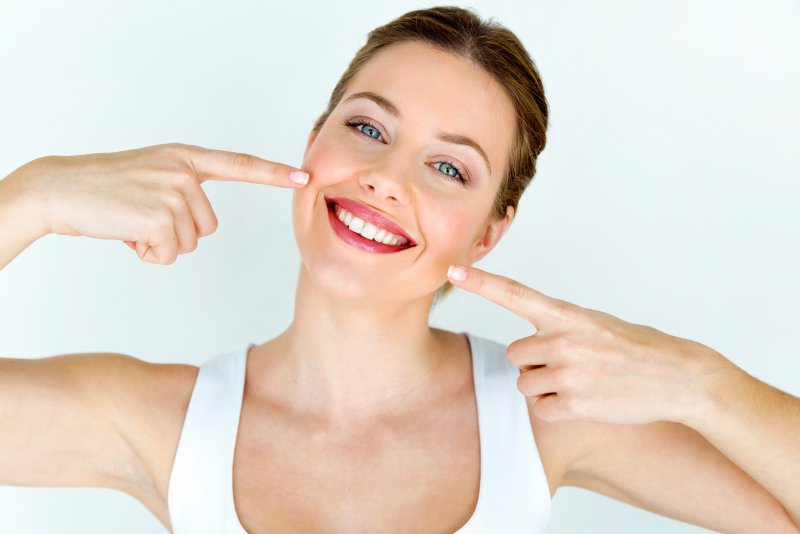 female teenager smiling with whiter teeth