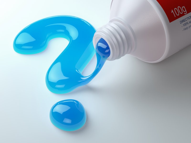 Blue toothpaste in the shape of a question mark