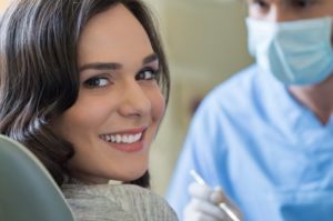 Woman smiling in dentist's chair.