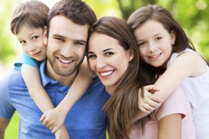 Happy family with beautiful smiles thanks to your whiting dentist Berquist Family Dentistry