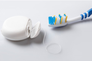 Toothbrush and floss