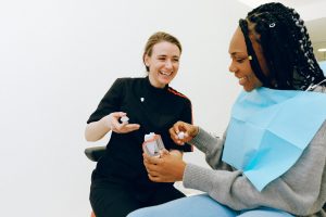 Woman at consultation for dental crowns in Crown Point