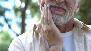 a patient suffering from facial pain